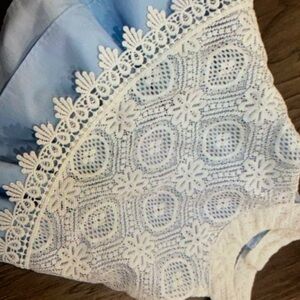 Sleeveless halter neckline ruffled stunning floral blouse